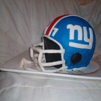 Giants Football Helmet I made this cake for a superbowl party. Thanks to everyone on this website who made one before me for their inspiration and great ideas.