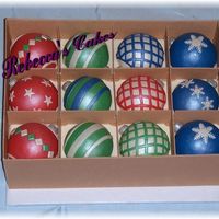 Christmas Ornaments This is a dummy cake I took to the 2008 ICES convention. "Sheet" cake with gumpaste box walls and dividers. Mini ball cupcakes...