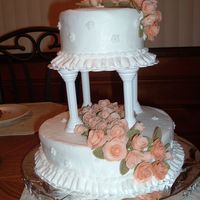 Dscf1066.jpg This is my Wilton Course 3 final cake. It is a white cake frosted with BC and the roses are fondant. I wish I would have used fondant on...