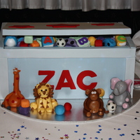 Toy Box With Gumpaste Animals This is toy box i did. All the toys and ofcourse the animals were made from Gumpaste. Had lots of fun making it! Thanks for looking.