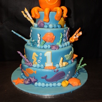Under The Sea Fun under the sea cake. Octopus body made out of styrofoam ball and his legs are icing. All sea creatures abound the base are chocolate and...