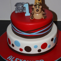 Jungle Animals Had lots of fun (and stress) making this 2 tier animal cake. Animals made of 50%gumpaste 50% rtr. Took alot longer than expected! Cake...