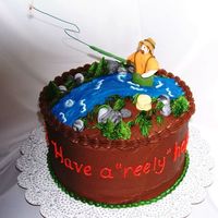 Fly Fishing 30Th Birthday Cake is chocolate with chocolate ganache filling and chocolate icing. Fishing figure and fishing basket are made from gumpaste. The pole...