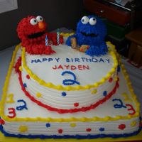 Elmo And Cookie Monster This i smy son's second 2nd birthday cake. (He has 3 because of not being able to get our family all together). Cake is french vanilla...