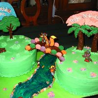 Dora And Diego This was a cake for my son and his cousin who were turning 2. All characters are chocolate transfers as are the bridge and trees. Cake is...