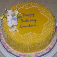 Gumpaste Flower Arrangement I made this cake for my Grandma. It is fondant with bc cornelli lace. Flowers are gumpaste.