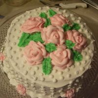 Practice Cake Just for fun. Didn't take a lot of time on it and this is a good example of what happens when you make roses from buttercream that is...