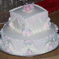 Teri Practice Cake Trial side cake for a wedding cake I have to do. It is white cake, cream cheese filling, buttercream frosting with royal icing roses,...
