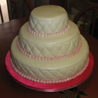 Angela & Josh's Wedding Cake I made this cake for my niece's wedding. It is a 14, 10, 6, the cake is french vanilla with baverain cream filling. It is covered in...