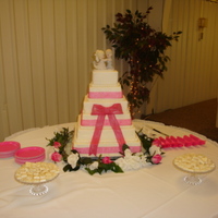 Pink And White All buttercream with fondant bow and fabric ribbon added at the last minute.