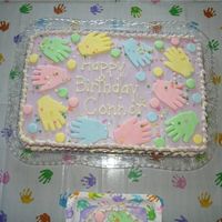 1St Birthday Cake-Handprint This is a first birthday cake for my son made to match the handprint theme of the accessories. The prints were made with pastel fondant and...