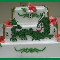 Img_1389.jpg Top 2 layer's are yellow cake. 1st layer filled with lemon curd. 2nd filled with european chocolate egg custard. Bottom layer is...