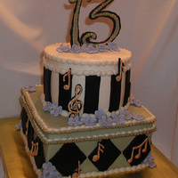 Music My son's thirteenth birthday cake. Buttercream, black fondant, and royal icing musical notes and flowers. Thanks for looking.