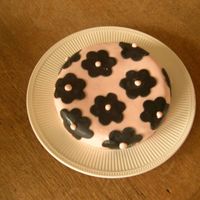 My First Fondant Cake! Chocolate cake with raspberry preserve covered in pink fondant and black flowers.