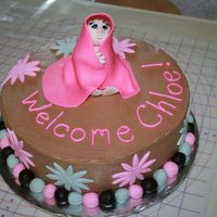 Welcome Chloe!! Here's a shower cake I did for a baby that had already arrived. It's a white cake, strawberry filling, chocolate buttercream, and...