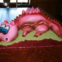 Pink Dragon Cake This is the first carved cake I've ever done. I accidentally smashed the spikes on it's back down and tried to repair it (as you...