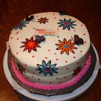 Halley's Birthday Cake White cake with buttercream icing. Flowers done in piping gel. Butterflies done wtih rice paper and edible markers.