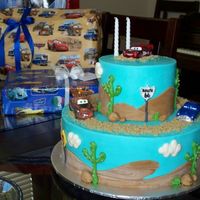 My Son's 2Nd Birthday Cake Buttercream with fondant hills, rocks, and street signs. Thanks cake central-ers for the inspiration!