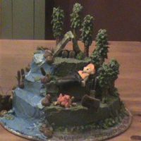 433.jpg I made this for my brother's 30th bday. If I remember correctly it is a single layer 6" 8" 10".. Buttercream and some...