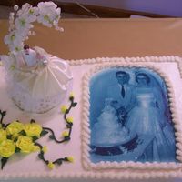50Th Anniv. 1/2 sheet cake with original wedding photo and cake topper