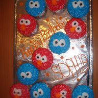 Elmo And Cookie Monster Cupcakes I made these cupcakes for my daughter's 2nd birthday. She loves Sesame Street.