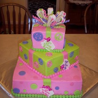 Gift Squares three girls all have bdays the same week of March. Each girl had own tier. Mom was using party supplies with Peace Signs.