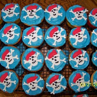 Pirate Cupcakes For my son to take to school for his bday. Jolly rogers made from fondant and color flow