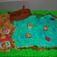New20001Ma21825481-0003.jpg Boat made from fondant/gum paste, teddy graham for people and goldfish for fish.