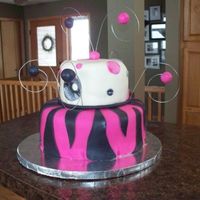 N1361176455_30335596_49404401.jpg This was for a 3-year-old girls birthday. She loves hot pink and black and wanted zebra stripes. Yellow cake and buttercream covered with...