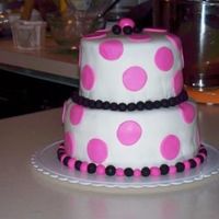 My First Attempt At.... This was my first attempt at both a stacked cake and using MMF. I have since learned to spread my supports out further to keep the cake...