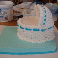 Bassinet Baby Shower Cake This is a chocolate cake covered in buttercream and the cover peice is fondant molded in half of a 3-D egg pan then covered with...