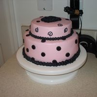 Pink And Black/gray Polka Dots And Swirls All buttercream except the circles. They are fondant. Still need to work on keeping the crumbs out of the icing. Can't seem to get the...