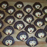 Dora Cupcakes Dora cupcakes for a preschool birthday party. The hair is made from melted chocolate andthe face is buttercream icing.