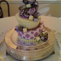 Topsy Turvy Graduation Cake All buttercream, with fondant bow loops and curlies. Made to match the graduation invitation.