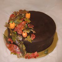 Thanksgiving, Fall Leaves Thanksgiving cake 2008. Chocolate cake with ganache filling. Chocolate fondant and gumpaste leaves & pumpkins.