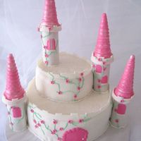Princess Castle Cake This was for a 8 year old girl who was having a Princess party. The cake is fondant covered, ice cream cones for the turrets and paper...