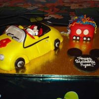 Mickey Mouse Car Cake This was done for my 4 year old's birthday. He loves Mickey Mouse Clubhouse. Mickey's car is actually red, but my red fondant...
