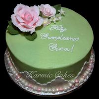 Cuca's Birthday Cake Birthday cake for my husbands 92 yr old grandmother. Buttercream 8" WASC cake with vanilla cream filling. Fondant decorations on sides...