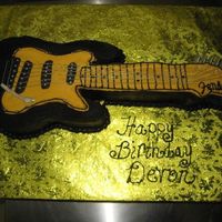 Guitar Cake This was my attempt at a guitar cake, it came out ok for my first. The client was happy so thats what matters.