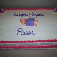 Sugar And Spice Fudge marble cake with buttercream icing, fonant baby and wiltons baby shower favors