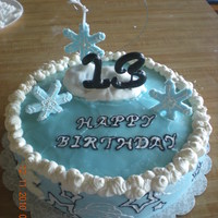 Winter Wonderland Buttercream, poured fondant, and rolled fondant mix. Snowflakes of fondant and cloud of marshmallow covered in fondant.