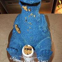 Cookie Monster Continental chocolate cake covered with vanilla cream, and then topped with fresh whipped cream. 30 servings.