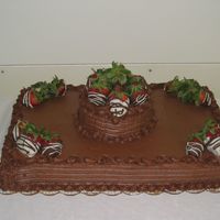 Chocolate Strawberries Chocolate Fudge cake with chocolate buttercream and hand dipped strawberries. The strawberries went over big & quick!!
