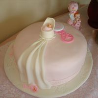 Hush Little Baby Is was was a 12 in round, Sock It to Me cake, (my version) with coconut flavored pink MMF. Cradle, Drape and Baby all made of gumpaste-...