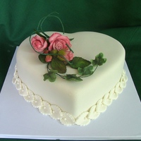 Heart Shapped Cake Covered with sugarpaste .Flowers are also made of sugarpaste/TFL