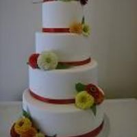 Autumn Splendor Fondant covered with ribbon and fresh flowers