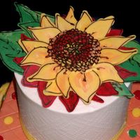 Sunflower Close Up detail of top of sonechko cakebuttercream (white) with candy melt sunflower