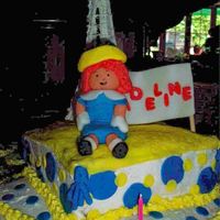 Madeline, France BC with fondant accent. Madeline and sign made of fondant. Eiffel tower made of royal icing.