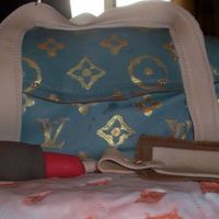 Lv Bag Carved chocolate cake covered with fondant and gold painted logo