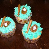 Baseball I made these cupcakes for my Son's T-ball team, this was our 1st year it was a blast. Grass is BC, bat, ball and glove are fondant.